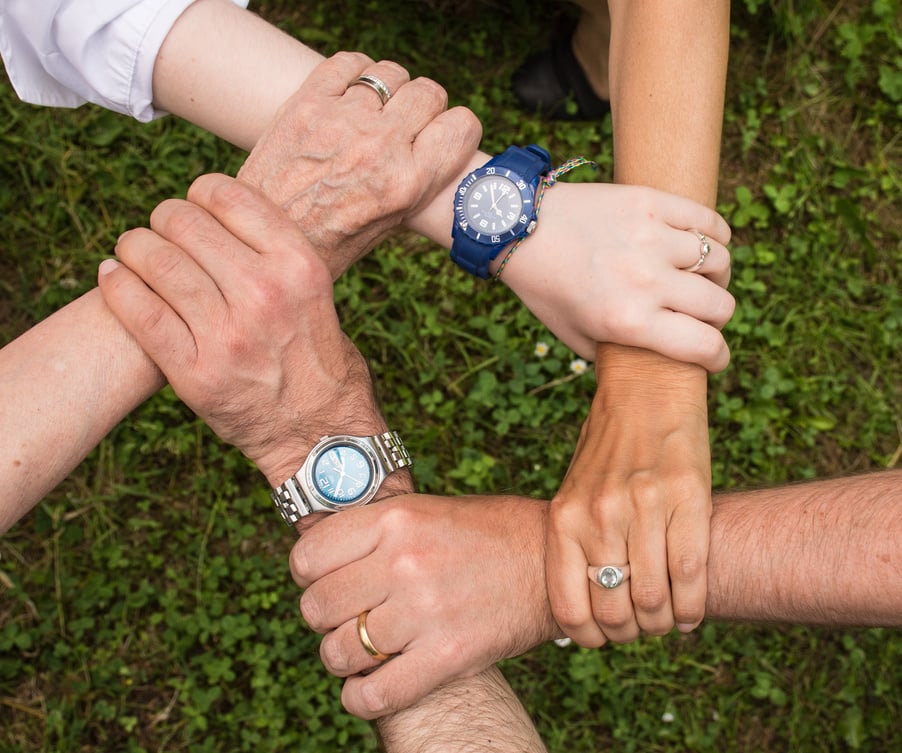 Team Putting Their Hands Together